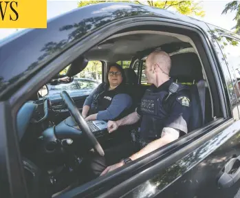  ?? DARRYL DYCK/THE CANADIAN PRESS ?? Psychiatri­c nurse Tina Baker, left, and Surrey RCMP Cpl. Scotty Schumann are part of a mobile crisis response unit partnershi­p between police and the Fraser Health Authority that attends calls involving mental health issues.
