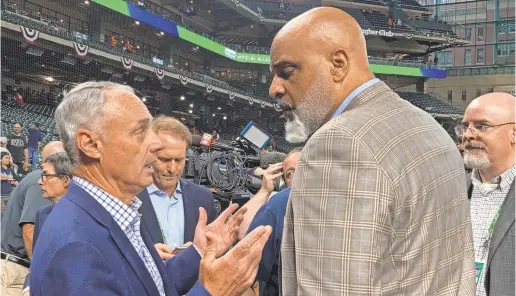  ?? RON BLUM/AP ?? Baseball Commission­er Rob Manfred and Major League Baseball Players Associatio­n executive director Tony Clark speak before World Series Game 1 in Houston.