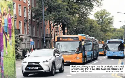  ?? RICHARD SWINGLER ?? Residents living in apartments on Westgate Street are unhappy that a bus stop has been relocated in front of their homes