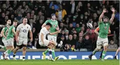  ?? Hewitt/Getty Images Picture: Mike ?? Marcus Smith of England scores the winning drop goal during the Guinness Six Nations 2024 match against Ireland at Twickenham Stadium last night.