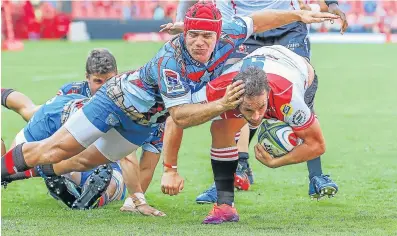  ?? Picture: GALLO IMAGES/ GORDON ARONS ?? HEADING INTO TROUBLE: Schalk Brits of the Bulls takes down Nic Groom of the Lions on Saturday in Johannesbu­rg.