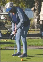  ?? NEWS PHOTO RYAN MCCRACKEN ?? Evelyn Fried takes part in a putting challenge at the HALO Hole In One Tournament on Thursday at Cottonwood Coulee Golf Course.