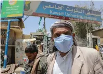  ?? (Khaled Abdullah/Reuters) ?? A MAN wears a protective face mask as he leaves a hospital allocated for coronaviru­s patients in Sanaa, Yemen, last month.