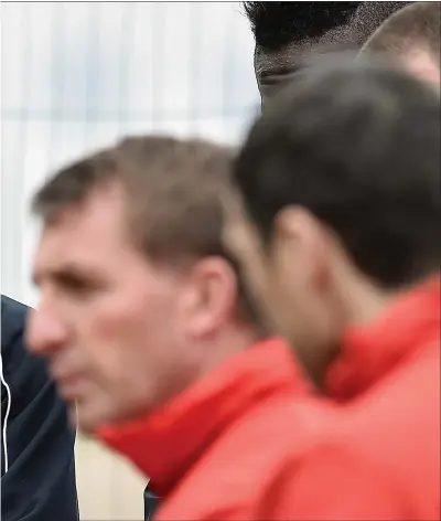  ?? Picture: Getty ?? Steven Gerrard watches on as Brendan Rodgers delivers a speech during their time at Liverpool