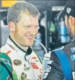  ?? — Photo by The Associated Press ?? Even though he finished fourth in Sunday’s Brickyard 400, Dale Earnhardt Jr., was all smiles because he still took over the Sprint Cup points lead.