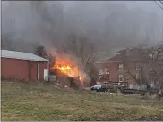  ?? COURTESY OF EXETER TOWNSHIP FIRE DEPARTMENT ?? A garage is was ablaze within feet of a home Wednesday morning at Limekiln and Wegman roads in Exeter Township.