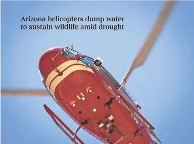  ??  ?? Pilot Scotty Mahon drops water in the Waterman Mountain water catchment outside Tucson. MARK HENLE/THE REPUBLIC