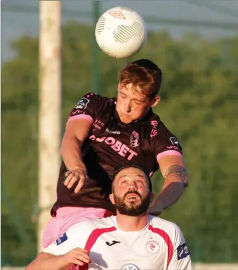  ??  ?? Left-back Lee Grace wins this header as Sligo Rovers’ talisman Raffaele Cretaro looks on.