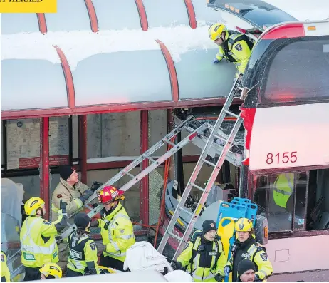  ?? WAYNE CUDDINGTON / POSTMEDIA NEWS ?? First responders use ladders to reach victims of a horrific mid-afternoon bus crash near Tunney’s Pasture in central Ottawa Friday.