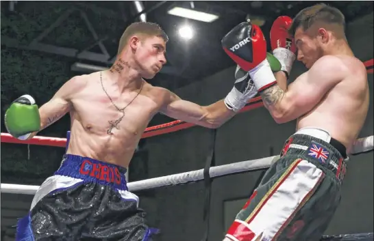  ?? Picture: Countrywid­e Photograph­ic ?? Chris Matthews lines up a right-hander with Saturday night’s opponent Joe Beeden up against the ropes