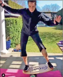  ??  ?? A BALANCED LIFESTYLE: Actress Brooke Shields grapples with some tricky exercises in her sunny garden
