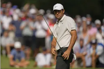  ?? ERIC GAY — THE ASSOCIATED PRESS ?? Scottie Scheffler watches his putt on the 15th hole during the second round of the PGA Championsh­ip on Friday at Tulsa, Okla. The Masters champion shot 75and was one of several big names to miss the weekend cut.