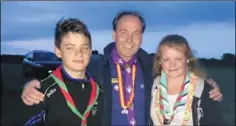  ??  ?? ABOVE: Josh Quigley Power and Haley Power with chief scout Christy McCann; RIGHT: scouts on the march.