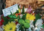  ?? Steve Gonzales / Staff photograph­er ?? A friend of the 16-year-olds killed in the crash, Salma Gomez and Chloe Robison, places flowers Wednesday at the accident scene on Timber Forest.