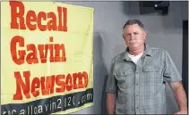  ?? FILE PHOTO: DAMIAN DOVARGANES — THE ASSOCIATED PRESS ?? In this March 27, 2021, file photo Orrin Heatlie, the main organizer for the Recall of California Gov. Newsom campaign, poses with a banner before recording a radio program at KABC radio station studio in Culver City.