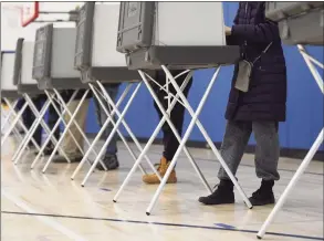  ?? Tyler Sizemore / Hearst Connecticu­t Media ?? Voters cast their ballots on Election Day at the District 8 polling center at Central Middle School in Greenwich on Nov. 3.