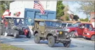  ??  ?? Area residents of Taylorsvil­le lined up on the side of the street to enjoy the 2019 Christmas parade.