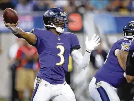  ?? JOE ROBBINS / GETTY IMAGES ?? Ravens quarterbac­k Robert Griffin III, who is trying to make a comeback after not playing last season, threw a TD pass and an intercepti­on Thursday.