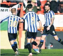  ??  ?? STAR IN STRIPES Double goalscorer Steven Fletcher (right)