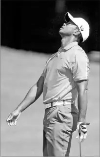  ?? — Photo by The Associated Press ?? Tiger Woods shows his frustratio­n after a bad shot on the third fairway during the first round of play in the PGA Tour Championsh­ip at East Lake Golf Club in Atlanta on Thursday.