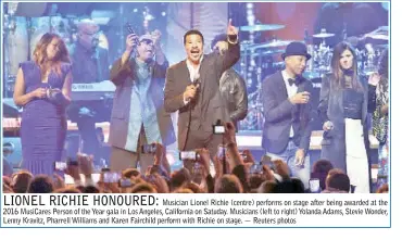  ??  ?? Musician Lionel Richie (centre) performs on stage after being awarded at the 2016 MusiCares Person of the Year gala in Los Angeles, California on Satuday. Musicians (left to right) Yolanda Adams, Stevie Wonder, Lenny Kravitz, Pharrell Williams and Karen Fairchild perform with Richie on stage. — Reuters photos