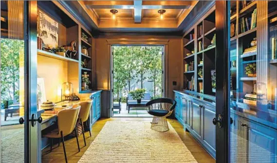  ?? Berlyn Photograph­y ?? BUILT-INS FILL opposite walls in the office/den of this Brentwood home, listed for $6.795 million by Coldplay manager Phil Harvey.