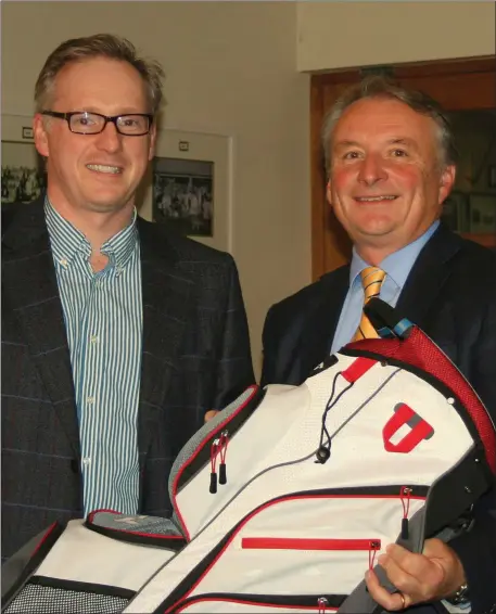 ??  ?? Barry Keane, winner of the Club Fourball Competitio­n at Laytown & Bettystown Golf Club, is presented with his prize by Vice Captain Bryan Collins, on behalf of competitio­n sponsor Paul Bermingham.