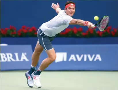  ?? AFP ?? Milos Raonic of Canada plays a shot against David Goffin of Belgium during a first round match of the Rogers Cup. —