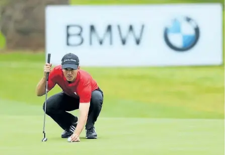  ?? WARREN LITTLE/GETTY IMAGES ?? Mike Weir of Canada lines up a putt on the 17th green during Day One of The BMW South African Open Championsh­ip on Jan. 11, in Johannesbu­rg, South Africa.