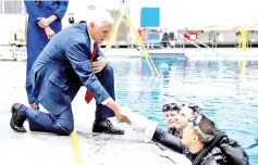  ??  ?? Pence with Nasa astronaut candidates (left to right) Loral O’Hara, Woody Hoburg, and Jonny Kim during a tour of the Neutral Buoyancy Laboratory at Johnson Space Center, in Houston,Texas. — AFP photo