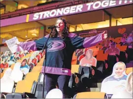  ?? Debora Robinson NHLI via Getty Images ?? ANGELIQUE FONG, introducin­g Ducks players Sunday, created an initiative to help the homeless, among other charitable acts, while fighting breast cancer.