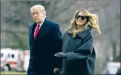 ?? Evan Vucci Associated Press ?? PRESIDENT TRUMP and First Lady Melania Trump arrive at the White House on Dec. 31.