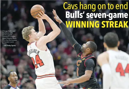  ?? — USA Today Sports ?? Chicago Bulls Lauri Markkanen (24) shoots against Cleveland Cavaliers guard Dwyane Wade (9) in the third quarter at Quicken Loans Arena.