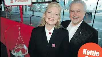  ??  ?? Salvation Army divisional secretary Patricia Cuff and advisory board member Thomas Skidmore kicked off their annual Christmas Kettle campaign at the Vancouver Convention Centre.