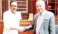  ??  ?? Anwar (left) meeting Dr Mahathir yesterday.