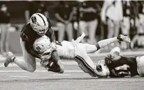  ?? Eric Gay / Associated Press ?? After safety Rashad Wisdom, left, was hit with his second targeting penalty of the year, UTSA coach Jeff Traylor said, “There’s a lot left after ball, so we need to keep Rashad safe.”