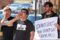  ?? PETE BANNAN – DIGITAL FIRST MEDIA ?? From left, Jamie Berg, sophomore at West Chester University, Aiden Castellano­s, University of Pennsylvan­ia student and West Chester University faculty member Dave Backer call on state Sen. Andy Dinniman to protect immigrant students during a protest...