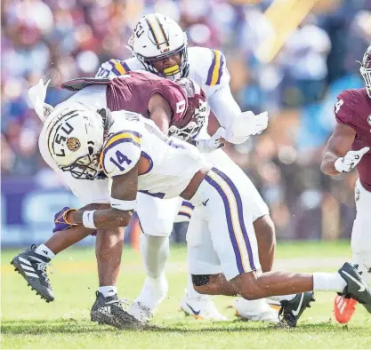  ?? SCOTT CLAUSE/USA TODAY NETWORK ?? LSU safety Andre’ Sam (14) signed with the Philadelph­ia Eagles.