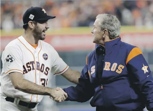  ?? DAVID J. PHILLIP/ASSOCIATED PRESS ?? Houston Astros starter Justin Verlander shakes hands with former U.S. president George W. Bush before Sunday’s epic Game 5 of the World Series. Verlander will be on the mound for Game 6 Tuesday in Los Angeles with a chance to give the Astros their...