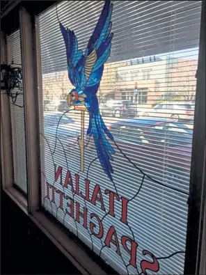  ?? Catherine Wessling / Courtesy photo ?? This window, which was damaged after Louisville’s iconic Blue Parrot Italian restaurant closed, is being restored with plans to be displayed in the front window of the Louisville Historical Museum.