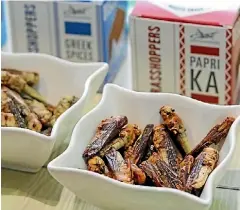  ?? JIMINIS ?? Ready-to-eat insect snacks include Sour Cream and Onion flavoured mealworms and grasshoppe­rs, pictured.