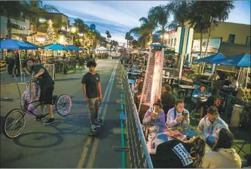  ?? Robert Gauthier Los Angeles Times ?? THE COVID-19 PANDEMIC has wreaked havoc on the restaurant industry, Gustavo Arellano writes, and many owners have considered shutting down for good. Above, Main Street in Huntington Beach on Saturday.