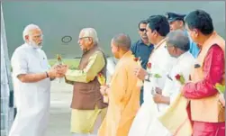  ?? PTI ?? PM Narendra Modi being received by UP governor Ram Naik and chief minister Yogi Adityanath on his arrival in Varanasi on Friday. The PM inaugurate­d 17 projects in his parliament­ary constituen­cy and ‘digitally’ laid the foundation stone of six other...