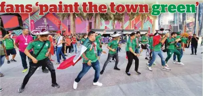  ?? PICTURES: Joey Aguilar ?? Mexican supporters entertain the crowd outside the DECC yesterday.