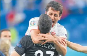  ?? Photo / AP ?? Mikel Oyarzabal hugs Unai Simon after winning the shootout.