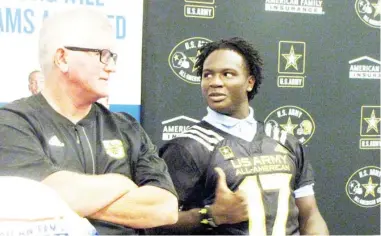  ?? ?? Coach Ricky Woods, left, visits with Willie Gay Jr. during an U.S. Army All-american Game ceremony at Starkville High School in 2016. (SDN file photo)