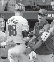  ?? NWA Democrat-Gazette/BEN GOFF ?? Arkansas coach Dave Van Horn congratula­te freshman Heston Kjerstad after his two-run home run in the eight inning Friday. It was Kjerstad’s second home run of the game.