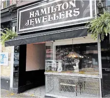  ?? CATHIE COWARD THE HAMILTON SPECTATOR ?? Robert Keleti, owner of Hamilton Jewellers at 148 James Street North, says awnings add a European flavour.