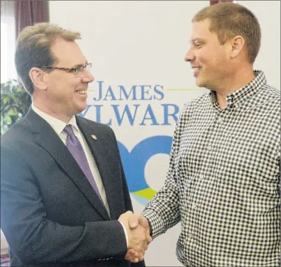  ?? MITCH MACDONALD/THE GUARDIAN ?? PC Party leader James Aylward, left, congratula­tes Charles Blue on becoming the new president of the party during the AGM at the Rodd Brudenell River Resort on Saturday. The AGM saw Blue elected to his position as well as Philip Brown being elected as...