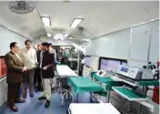  ??  ?? Railway Minister Suresh Prabhu and Health Minister JP Nadda being briefed after inaugurati­ng two additional coaches for Cancer and Family Health Services on the Lifeline Express, in New Delhi on Thursday
